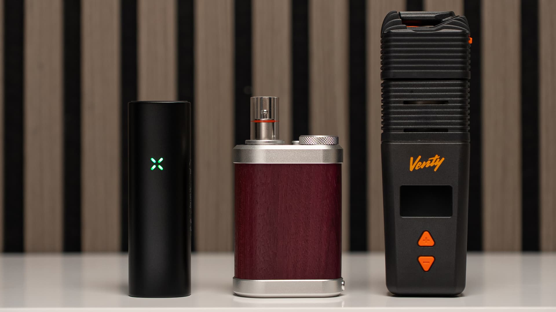 PAX Flow with green LED lined up with Tinymight 2 and Venty showing size differences