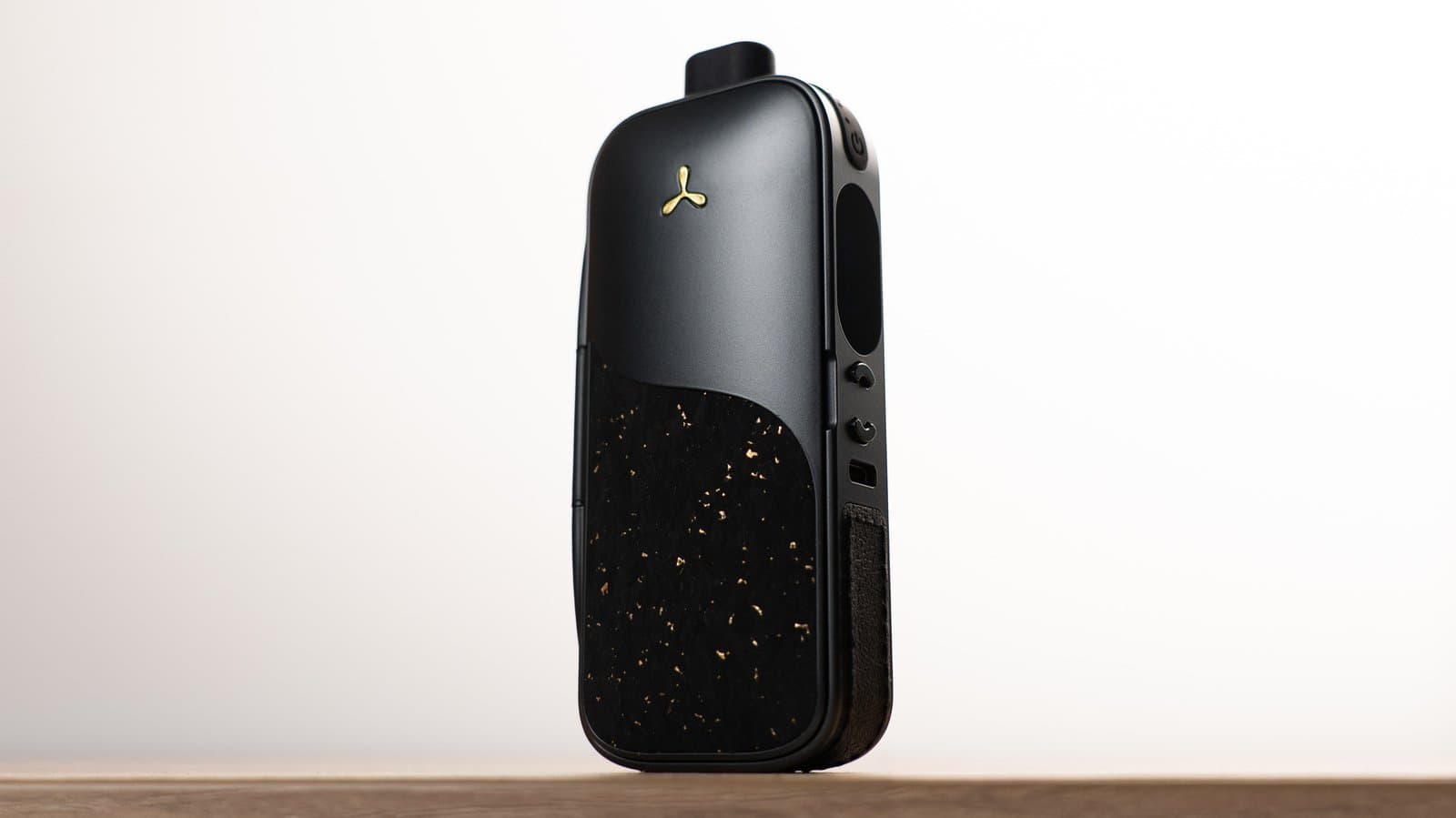 AirVape Legacy Pro 2 angled showing cork panel and side controls on wood