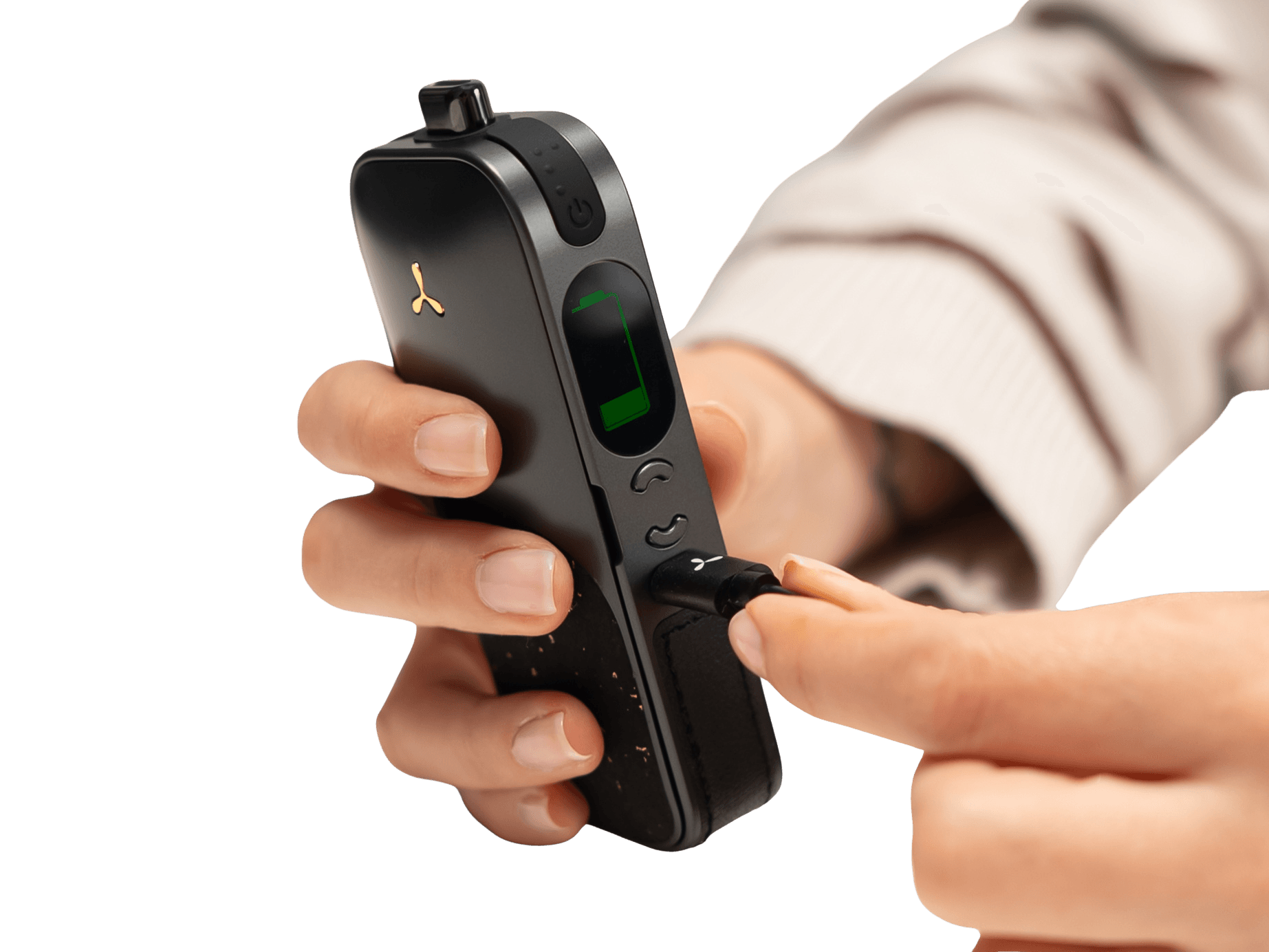 Hands plugging USB-C cable into AirVape Legacy Pro 2 with charging display lit