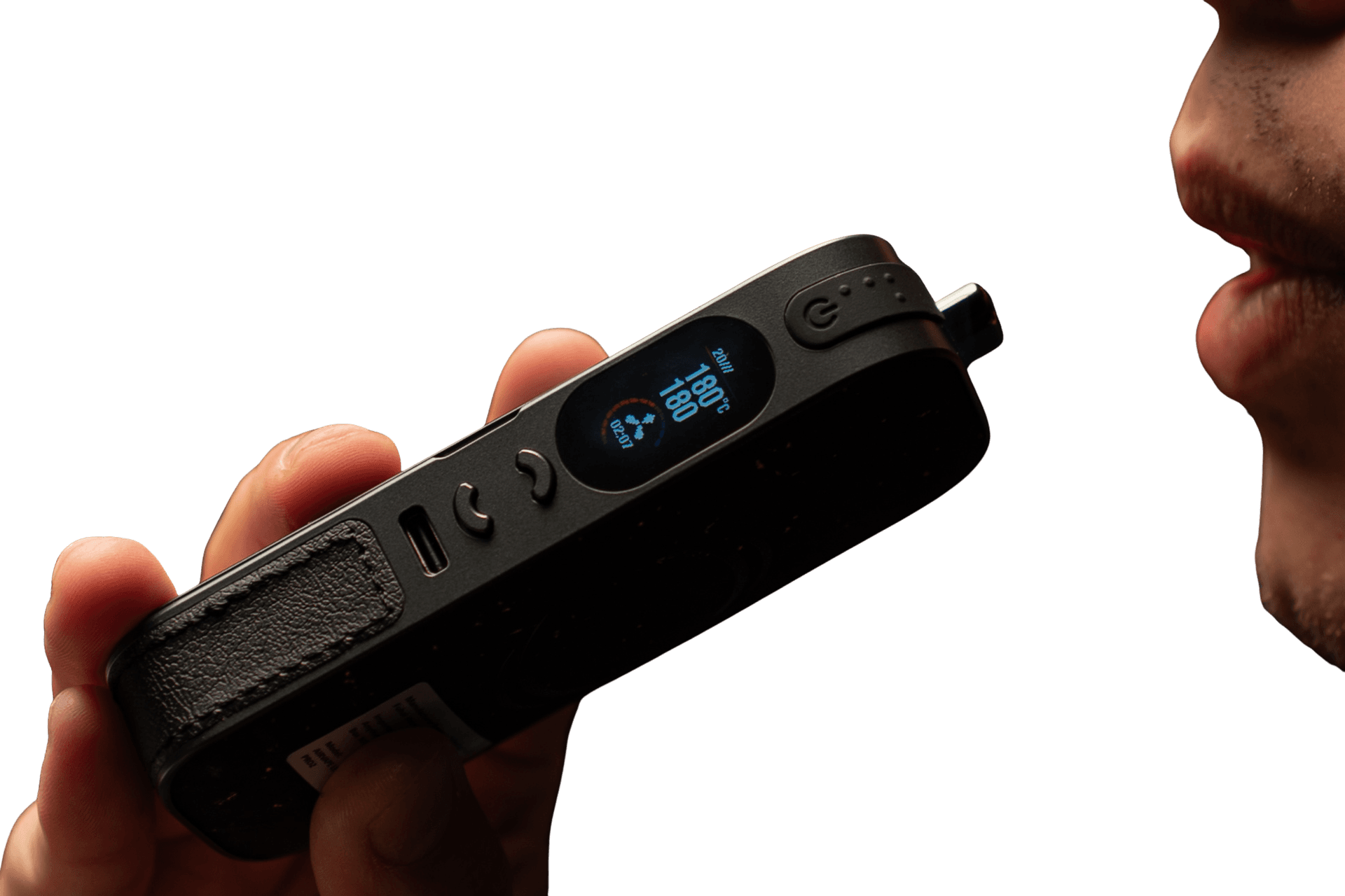 Person vaping from AirVape Legacy Pro 2 producing visible vapor against dark moody background