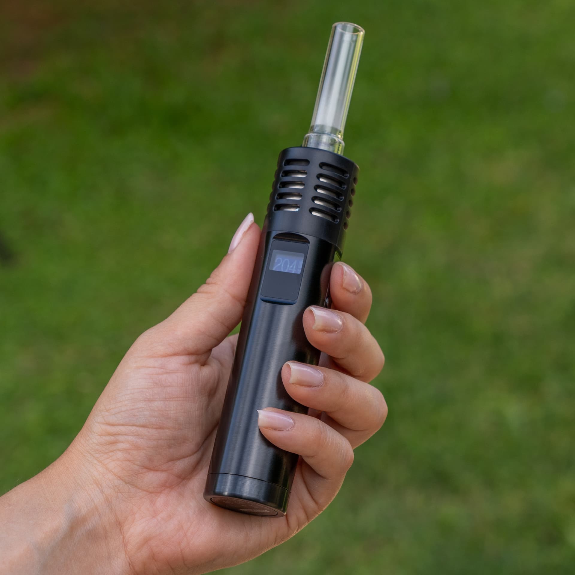Air Max in hand with the glass stem inserted and the display lit