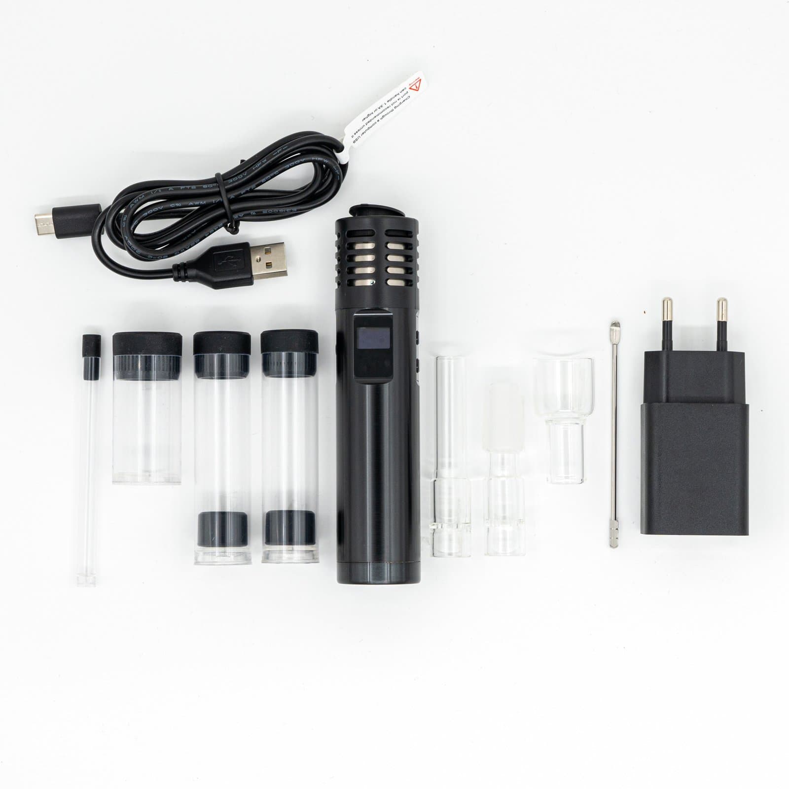 Full kit flat lay: vaporizer, USB cable, charger, glass stems, tool