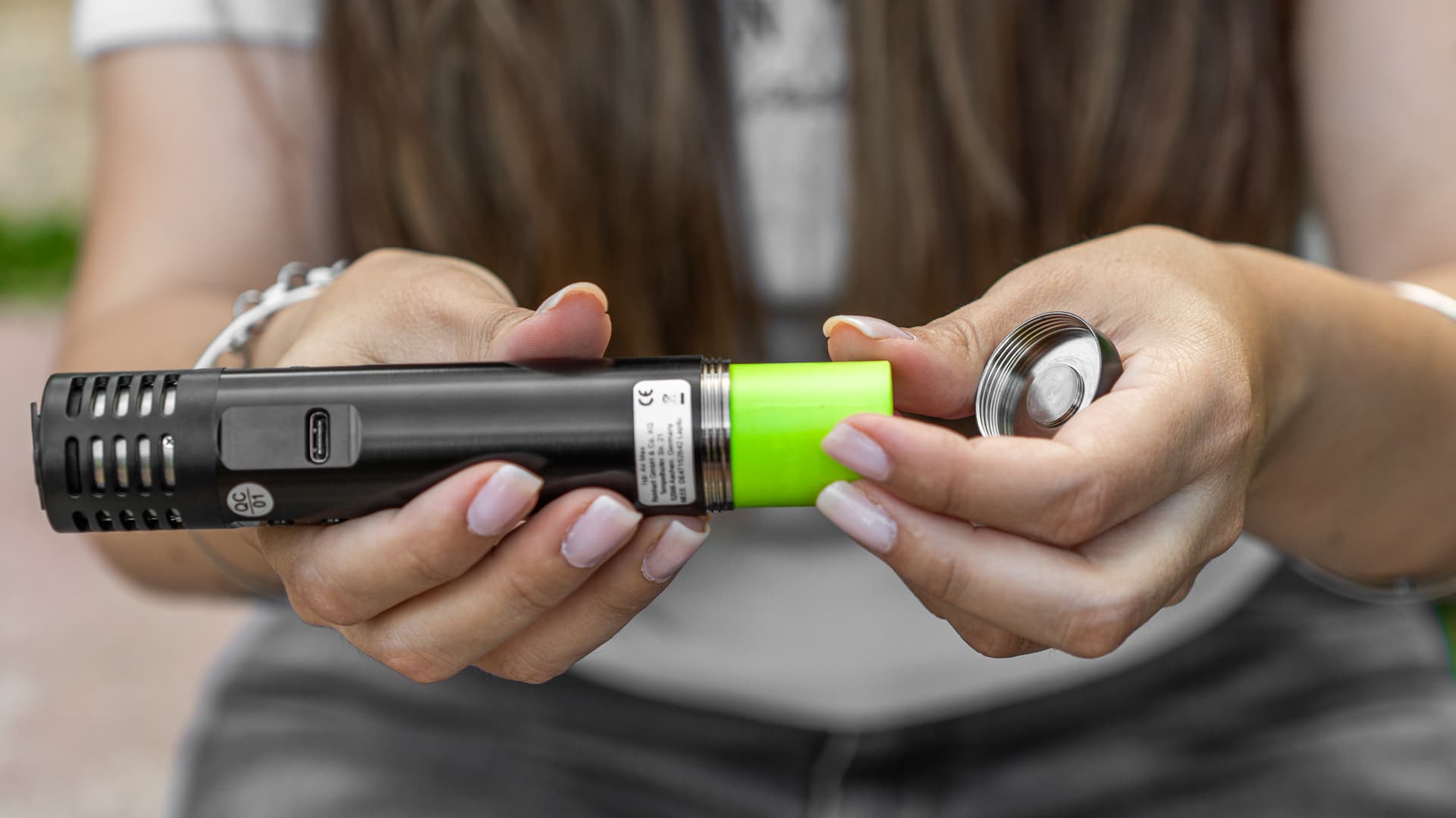 Removable 18650 battery being inserted into the base of the Arizer Air Max