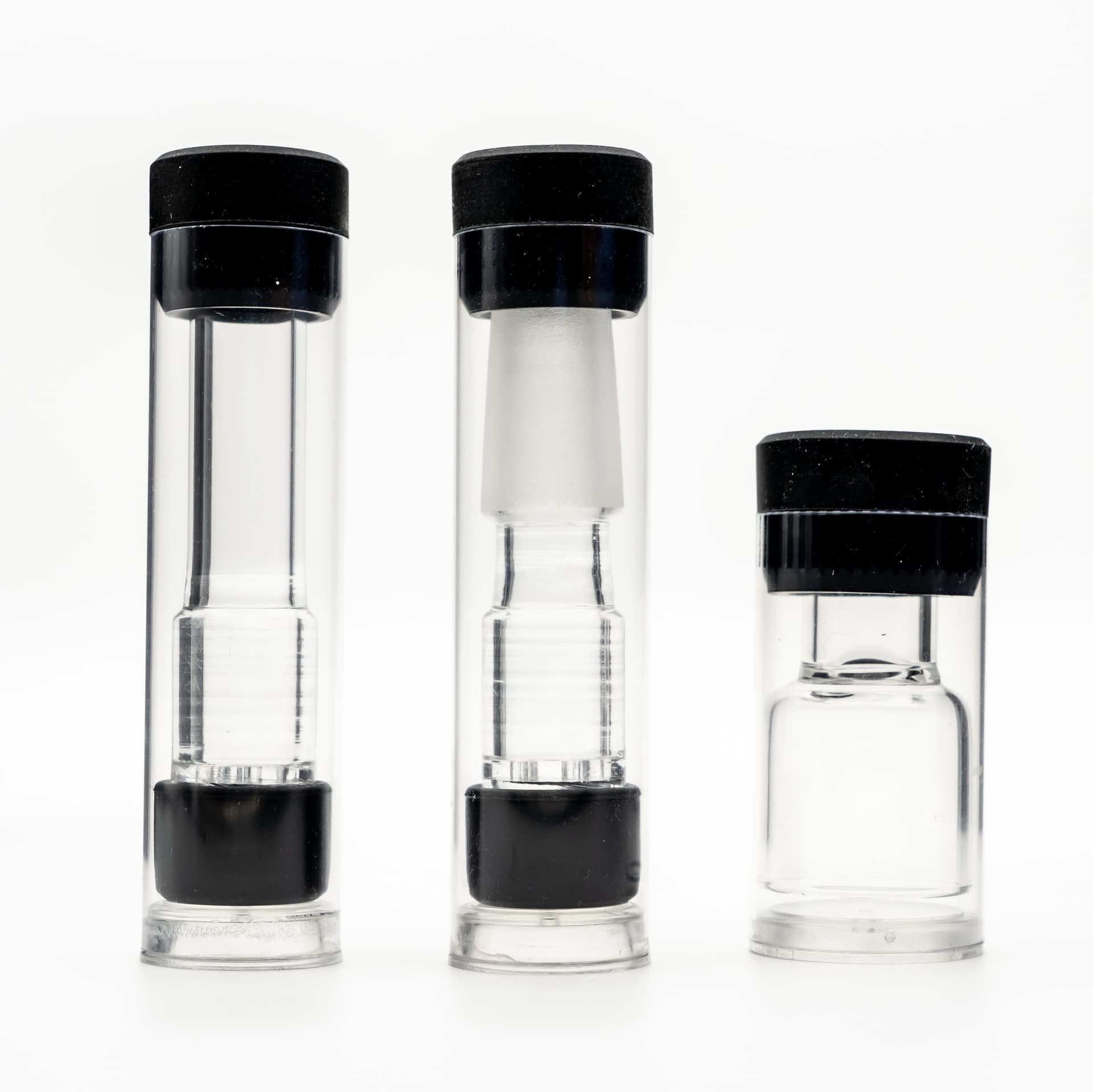 Arizer borosilicate glass aroma tubes laid out on a wooden surface, showing the all-glass vapor path