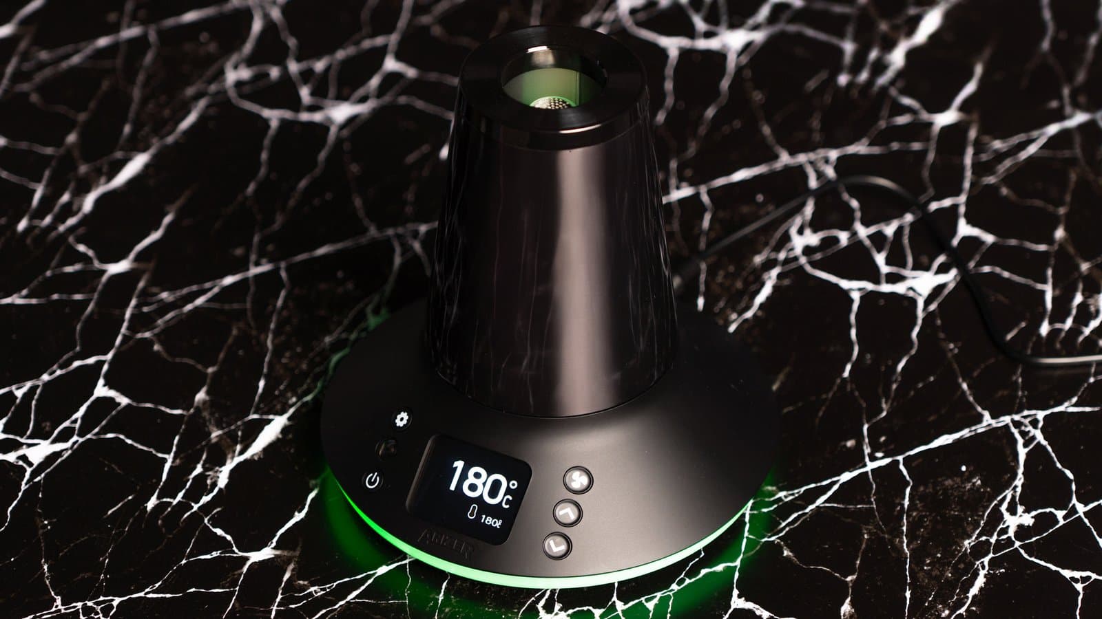 XQ2 at 180C glowing green on black marble surface