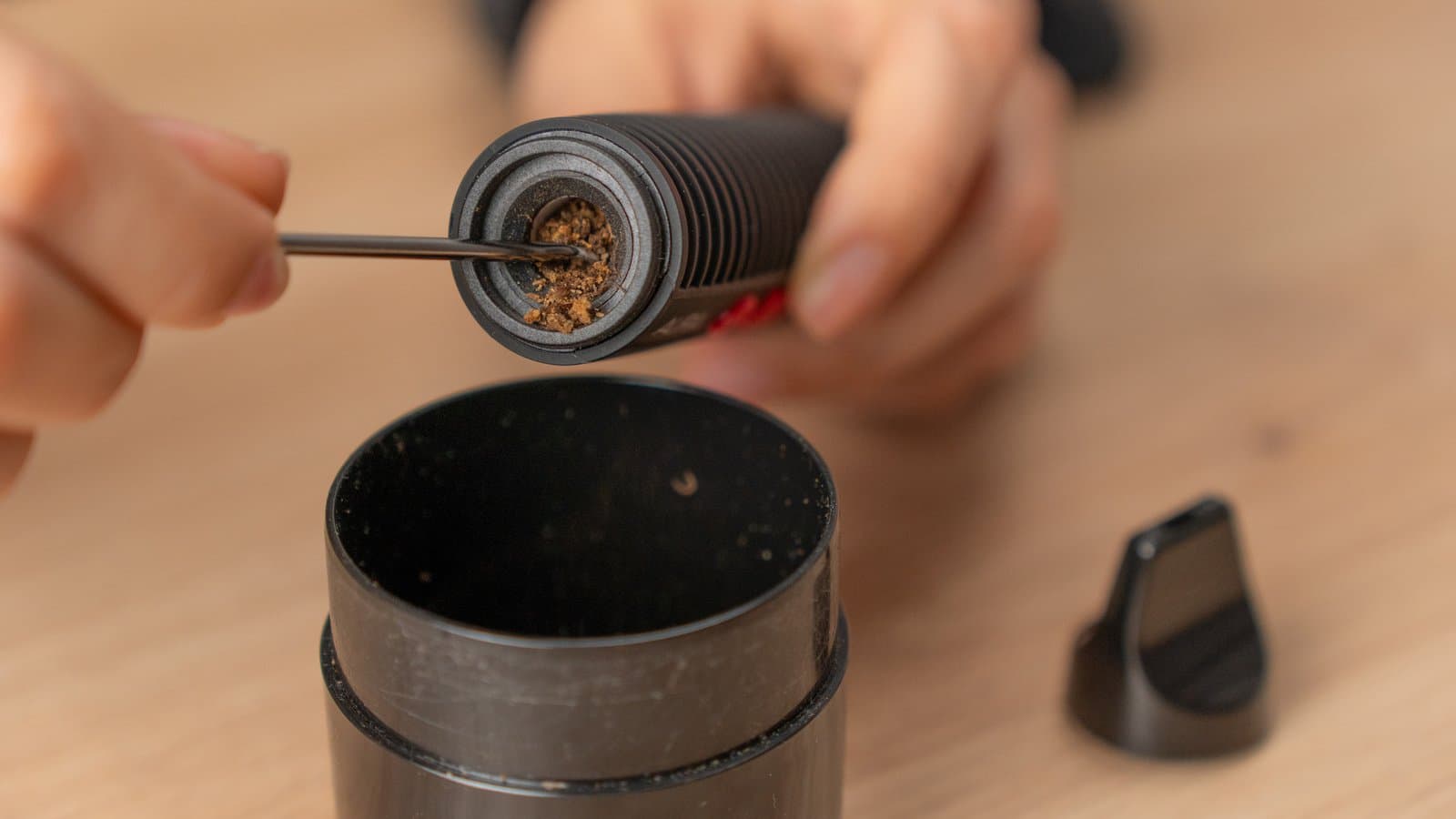 Emptying spent cannabis from the Aura oven with the stirring tool