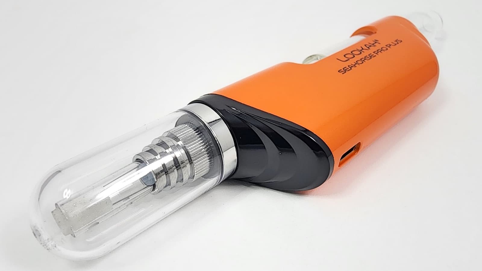 Close-up of orange Lookah Seahorse Pro Plus showing glass tube and heating element detail
