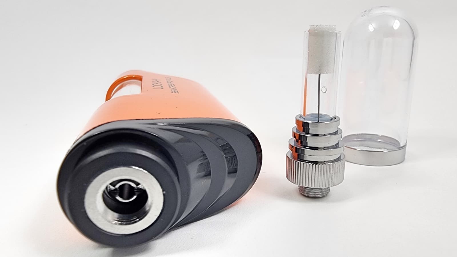 Orange Lookah Seahorse Pro Plus disassembled showing 510 connection port and glass cartridge