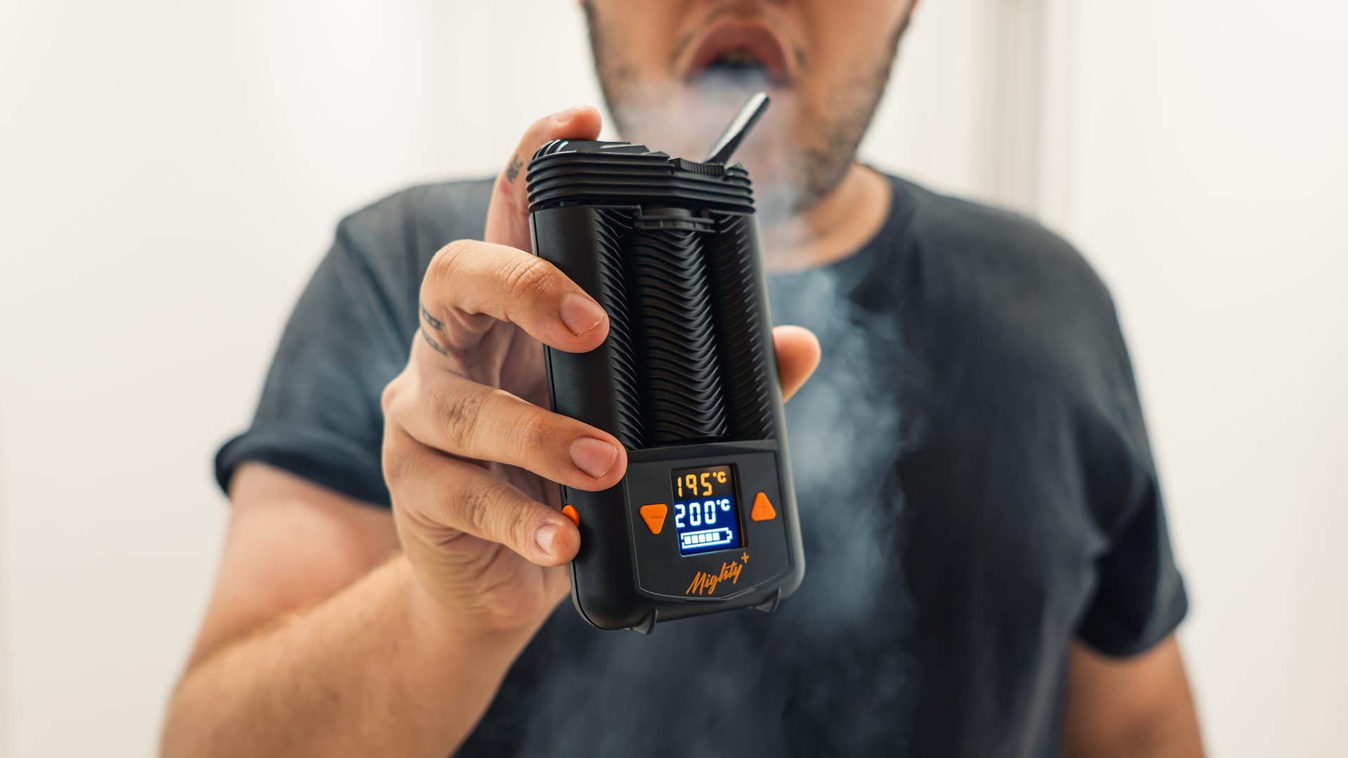 Mighty Plus vaporizer producing vapor during a real-world testing session