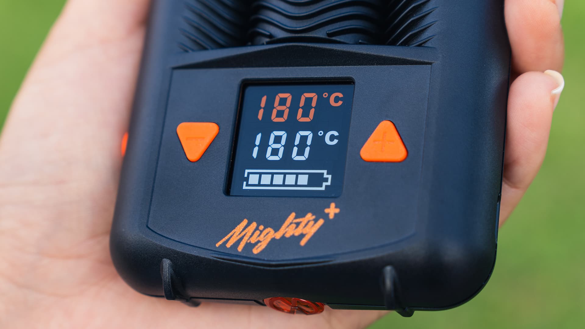 Close-up of a Mighty+ OLED display showing 180°C with 1°C precision indicator visible