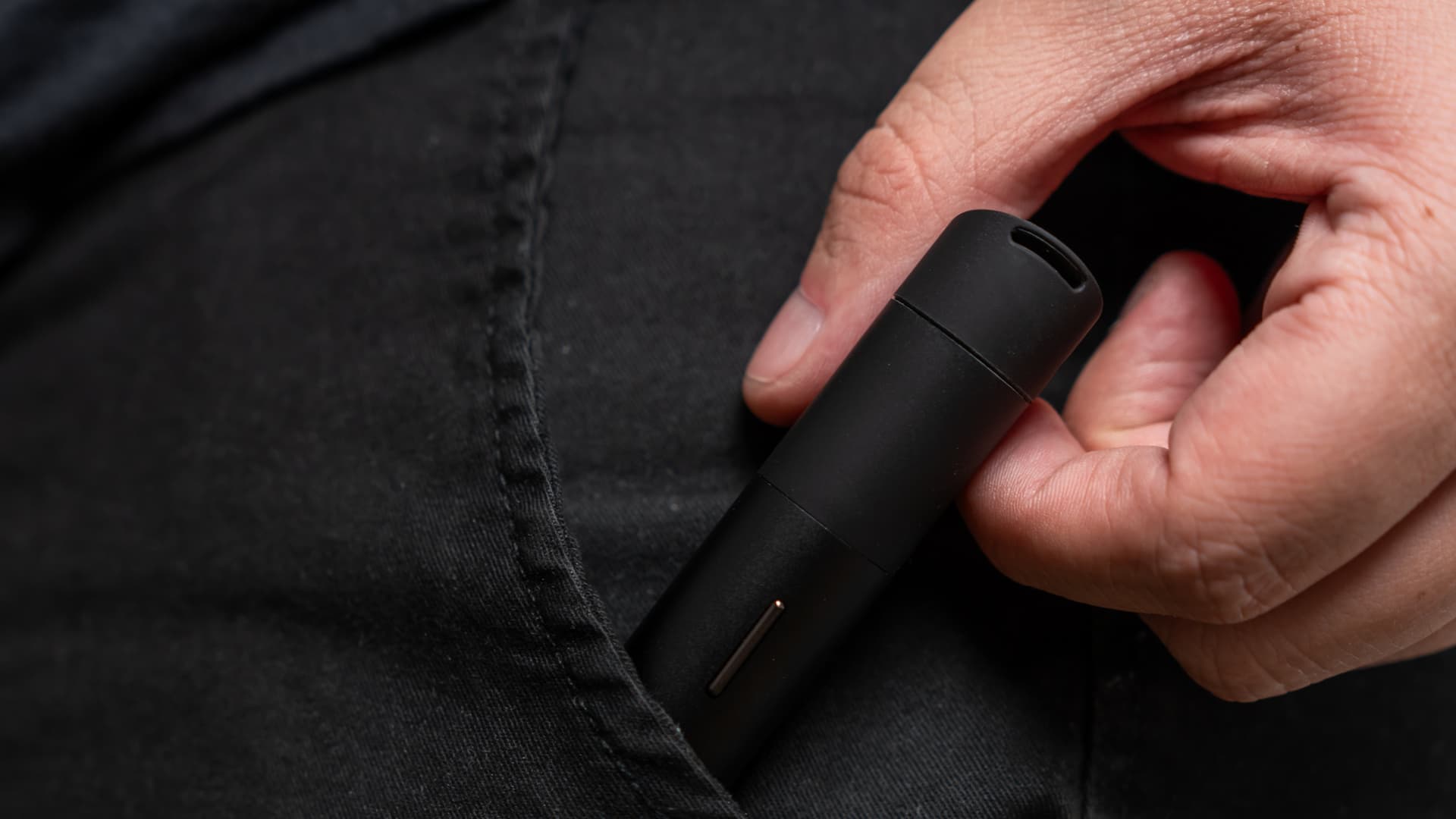 The Puffco Pivot dab pen being slid into a pocket