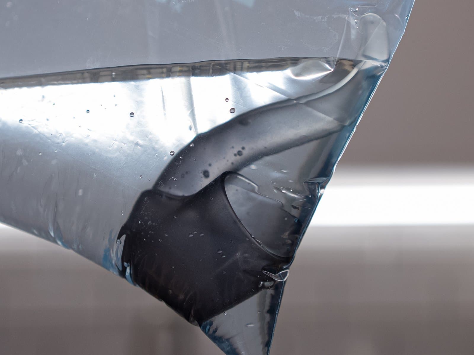 Detached Proxy glass pipe in liquid inside a sealed bag