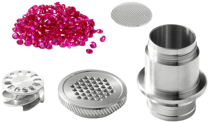 Disassembled Ruby Twist Pro titanium chamber with ruby corundum beads, mesh screen, and internal parts