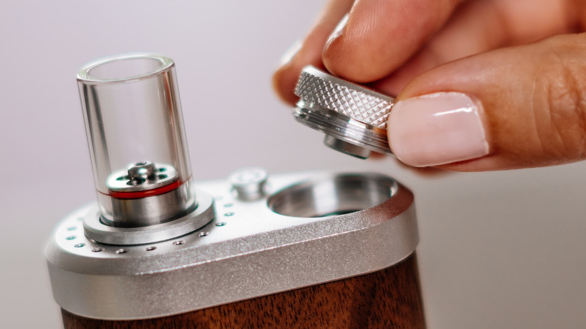 Tinymight 2 replaceable 18650 battery being inserted showing easy swap design