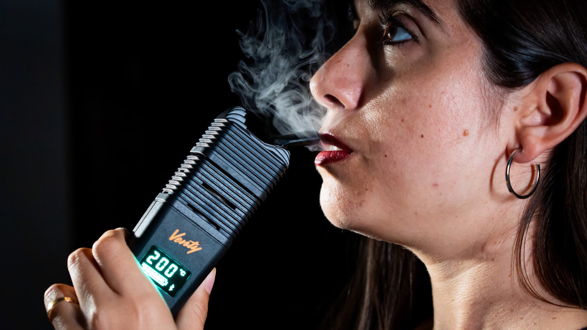 Venty session vaporizer held in hand, heated and ready for a full bowl