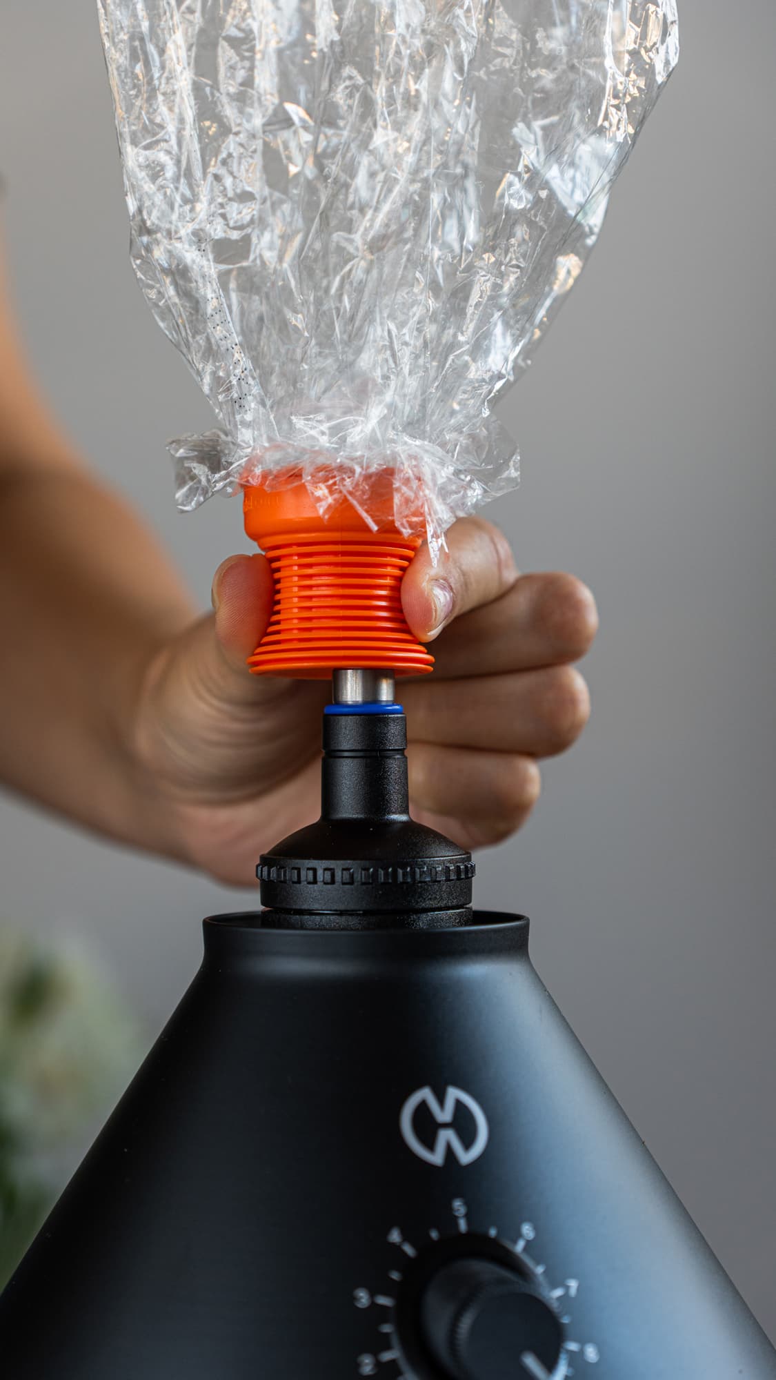 Pressing an Easy Valve balloon onto the filling chamber on a black Volcano Classic