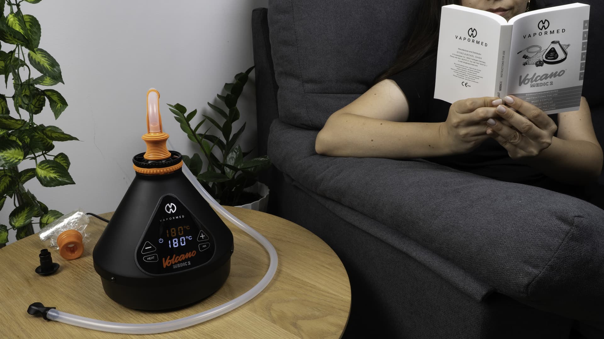 The Volcano Medic 2 set up in a calm domestic interior with a whip attachment visible, warm natural light