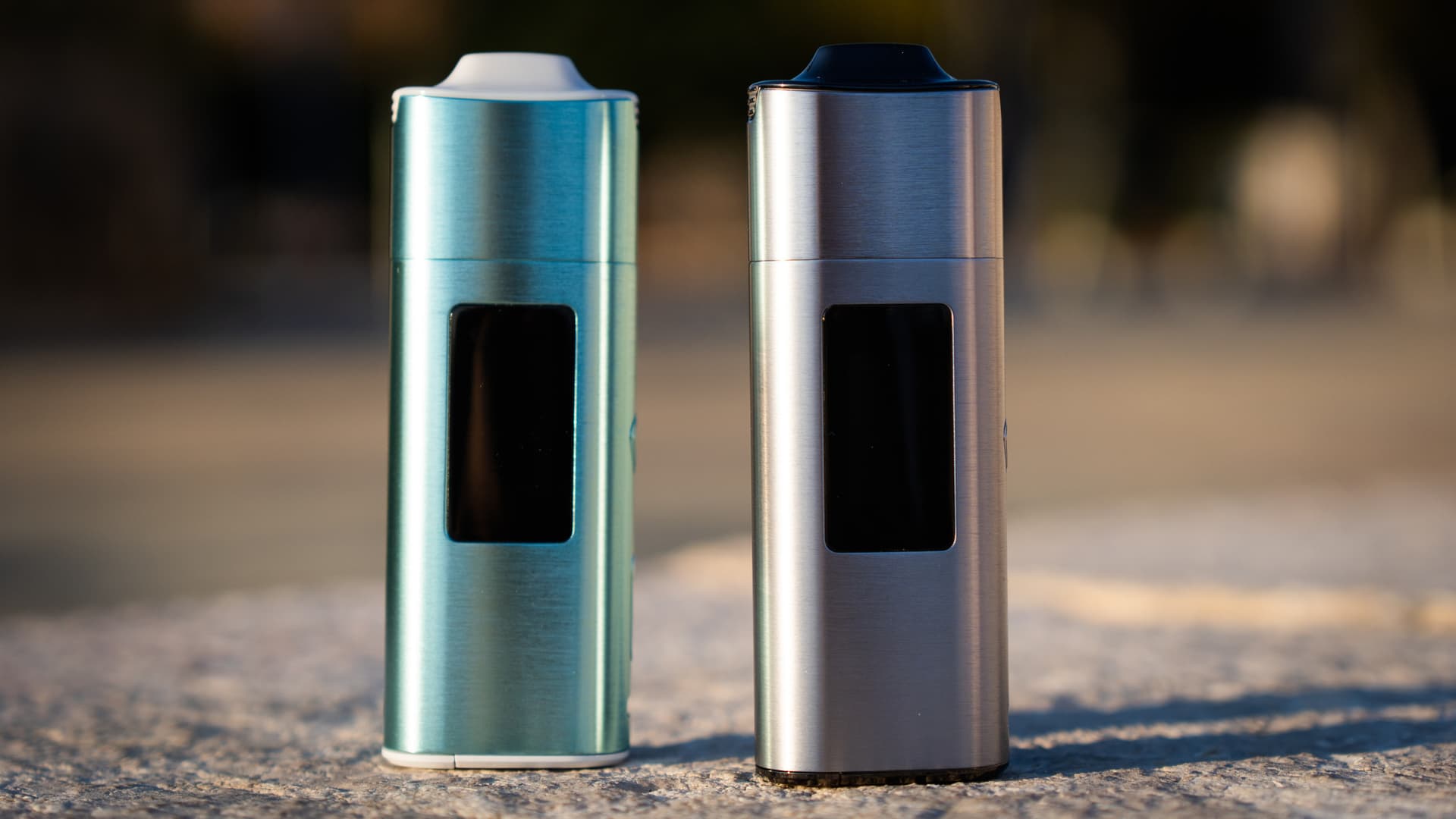 XLUX Roffu teal and silver variants side by side outdoors showing design differences