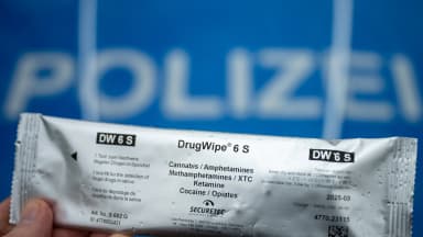 A police officer holds a "DrugWipe 6 S" test kit used to screen road users for cannabis, amphetamines, XTC, ketamine, cocaine and opiates during a traffic stop on Berliner Straße in Trebbin, Brandenburg, Germany, on Friday, March 22, 2024. | Soeren Stache/dpa/picture-alliance/Newscom