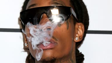 Wiz Khalifa exhales smoke at the Merging Vets and Players Charity Super Bowl Kick-Off Benefit at Academy LA Nightclub in Los Angeles on Wednesday, Feb. 9, 2022. | Kathy Hutchins/Hutchins Photo/Newscom