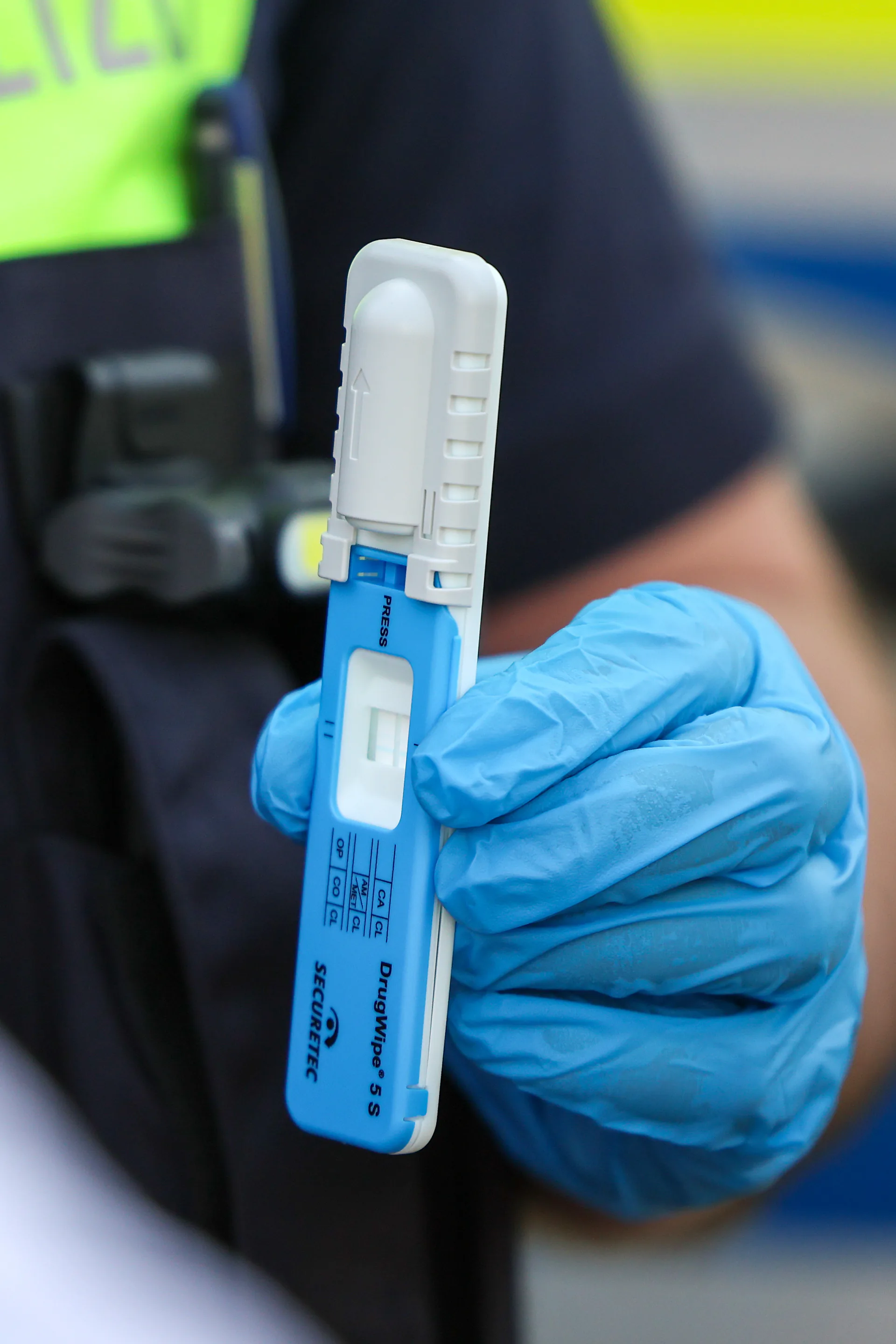 A police officer holds a rapid drug test during a traffic stop in Duesseldorf, Germany, February 26, 2026. The saliva test checks for possible narcotics in road traffic.