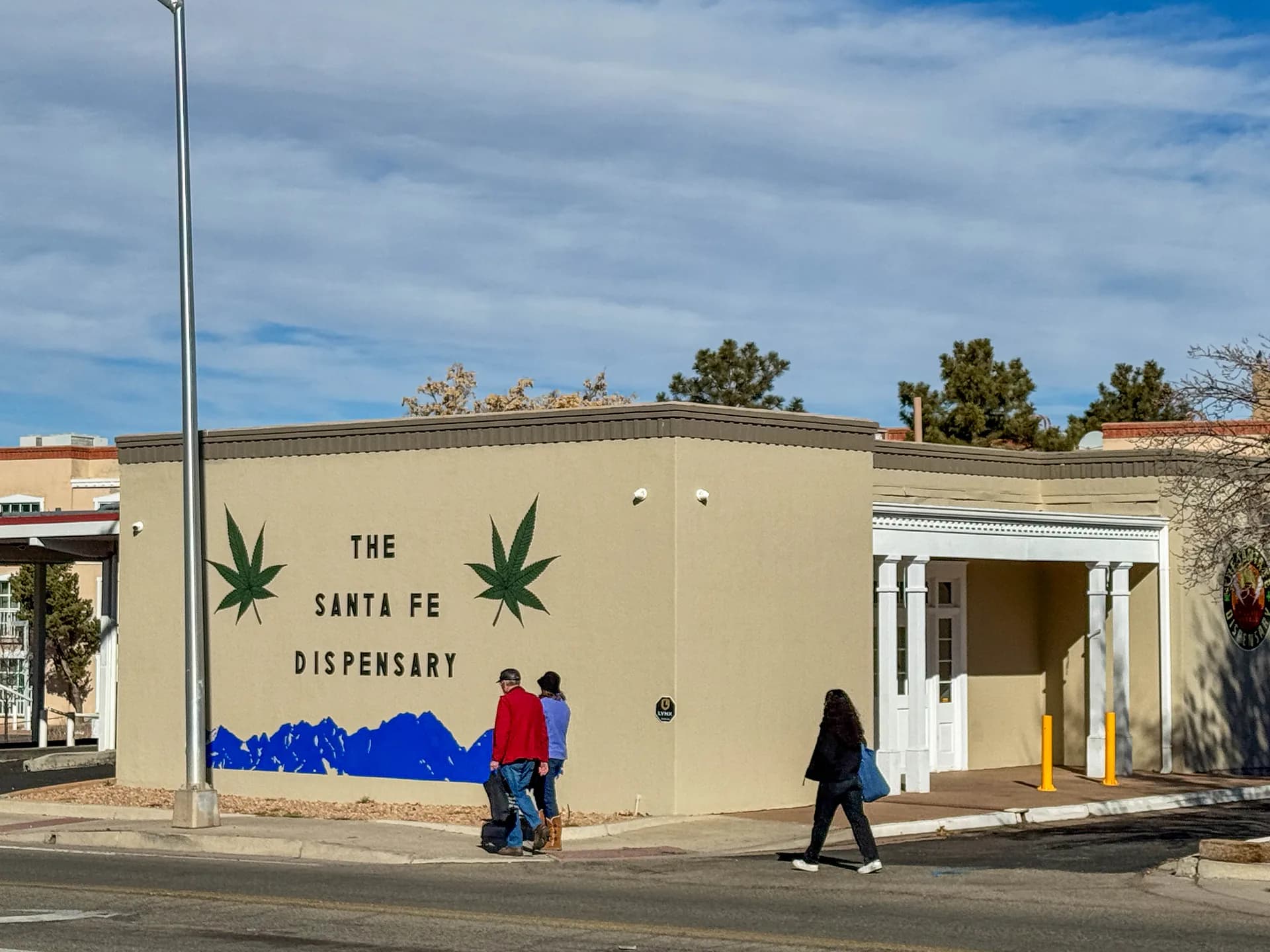 People walk by a marijuana dispensary in Santa Fe, New Mexico, on Saturday, Jan. 4, 2025. | Jesse Paul/Colorado Sun/ZUMA Press/Newscom