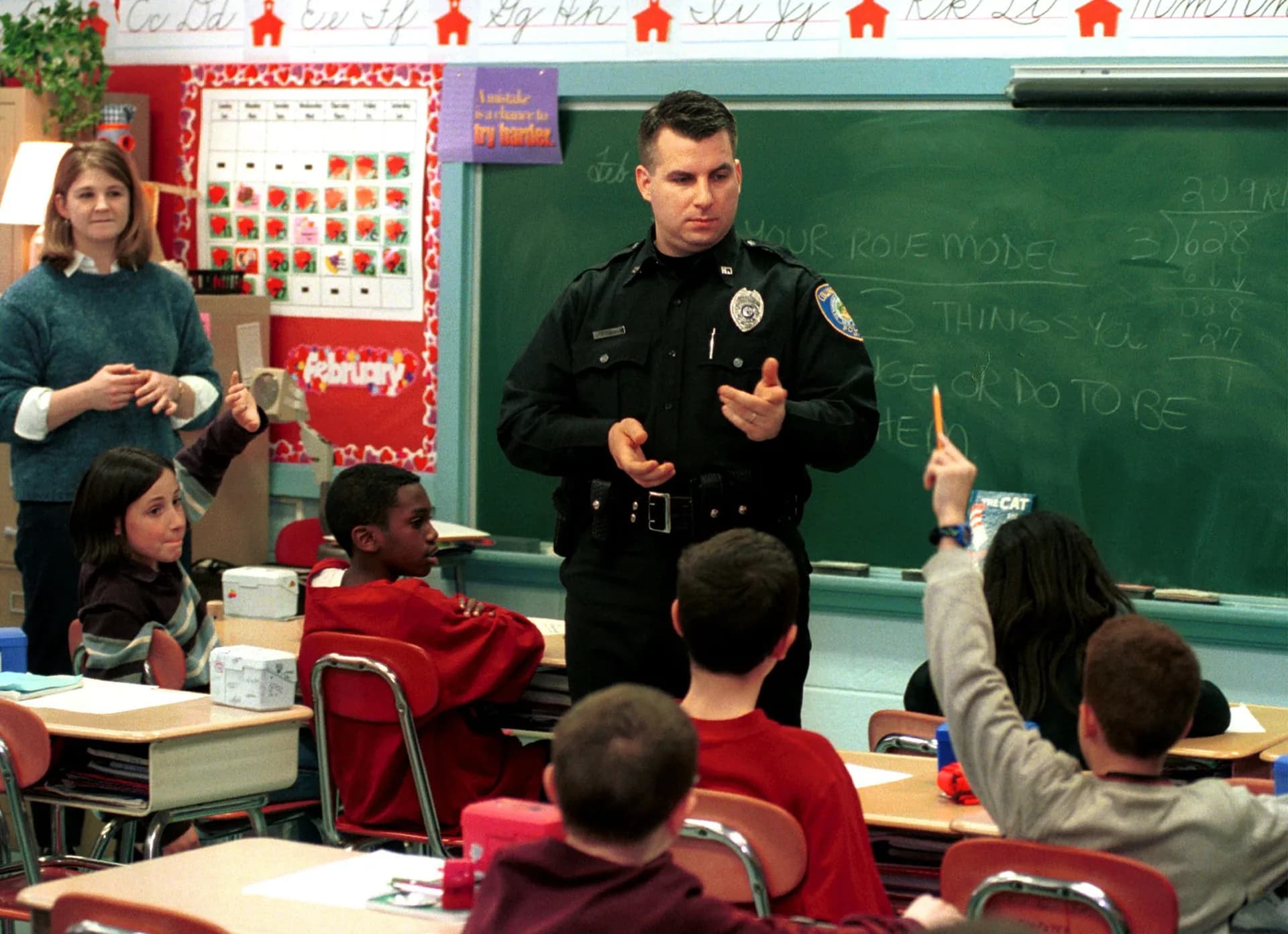Collingswood, New Jersey police officer Steve Rydzewski talks to students at Zane North School as part of the DARE program on March 7.