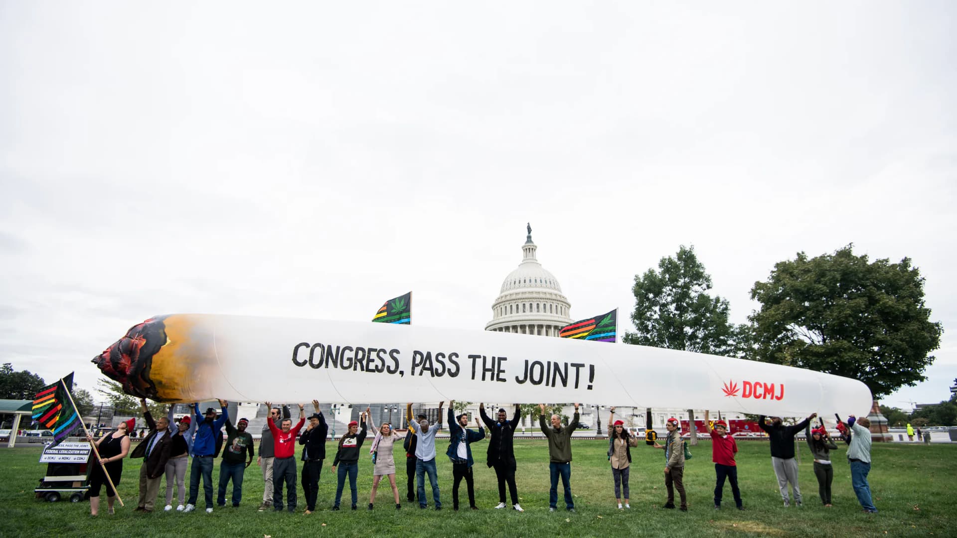 Marijuana activists hold up a 51-foot inflatable joint during a rally at the U.S. Capitol to call on Congress to pass cannabis reform legislation on Tuesday, Oct. 8, 2019. | Bill Clark/CQ Roll Call/Newscom