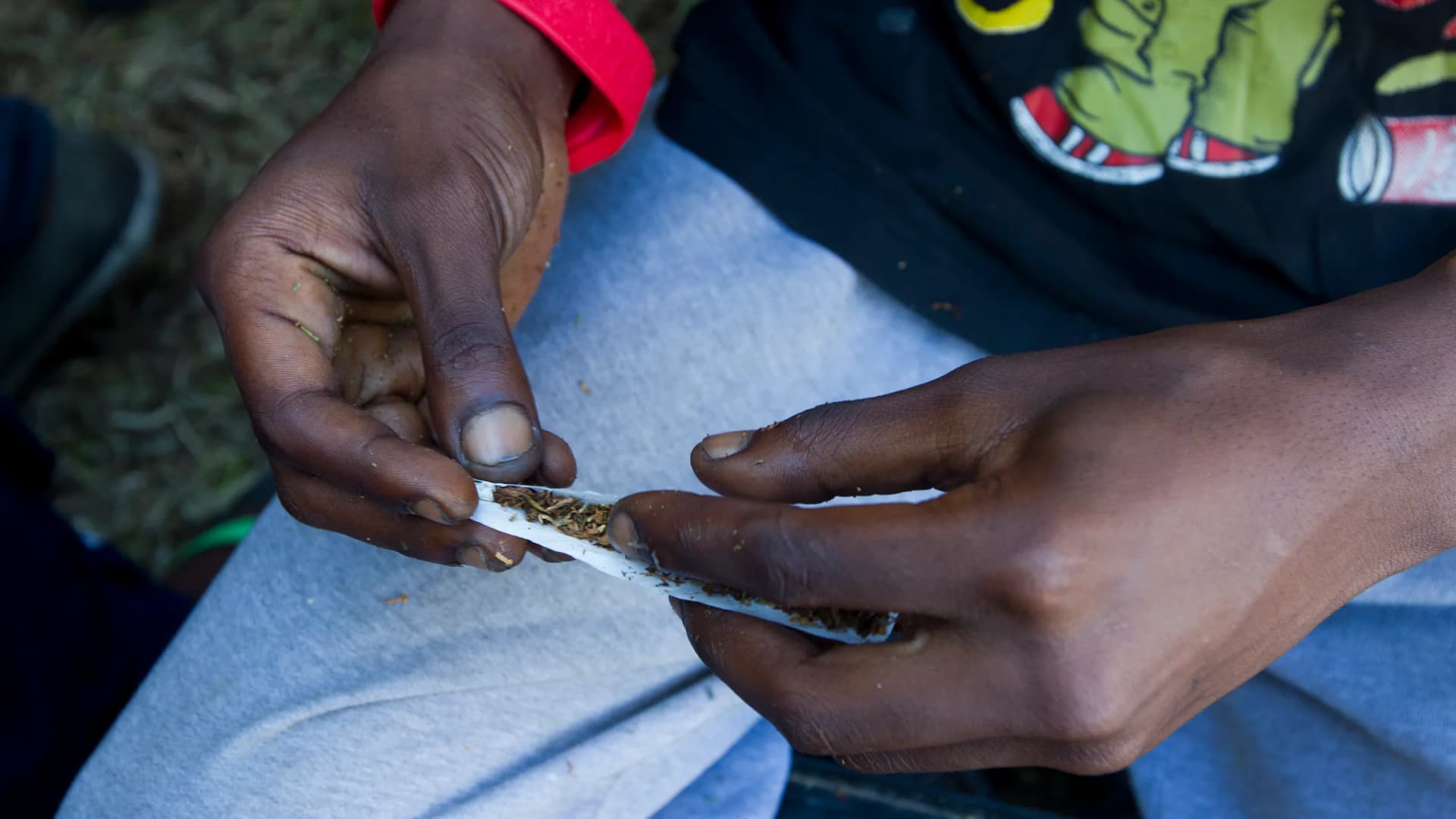 A man who lives in Albert Park rolls a dagga (marijuana) joint in Durban, South Africa, on Tuesday, Feb. 11, 2014. | Rogan Ward/Africa Media Online/Newscom