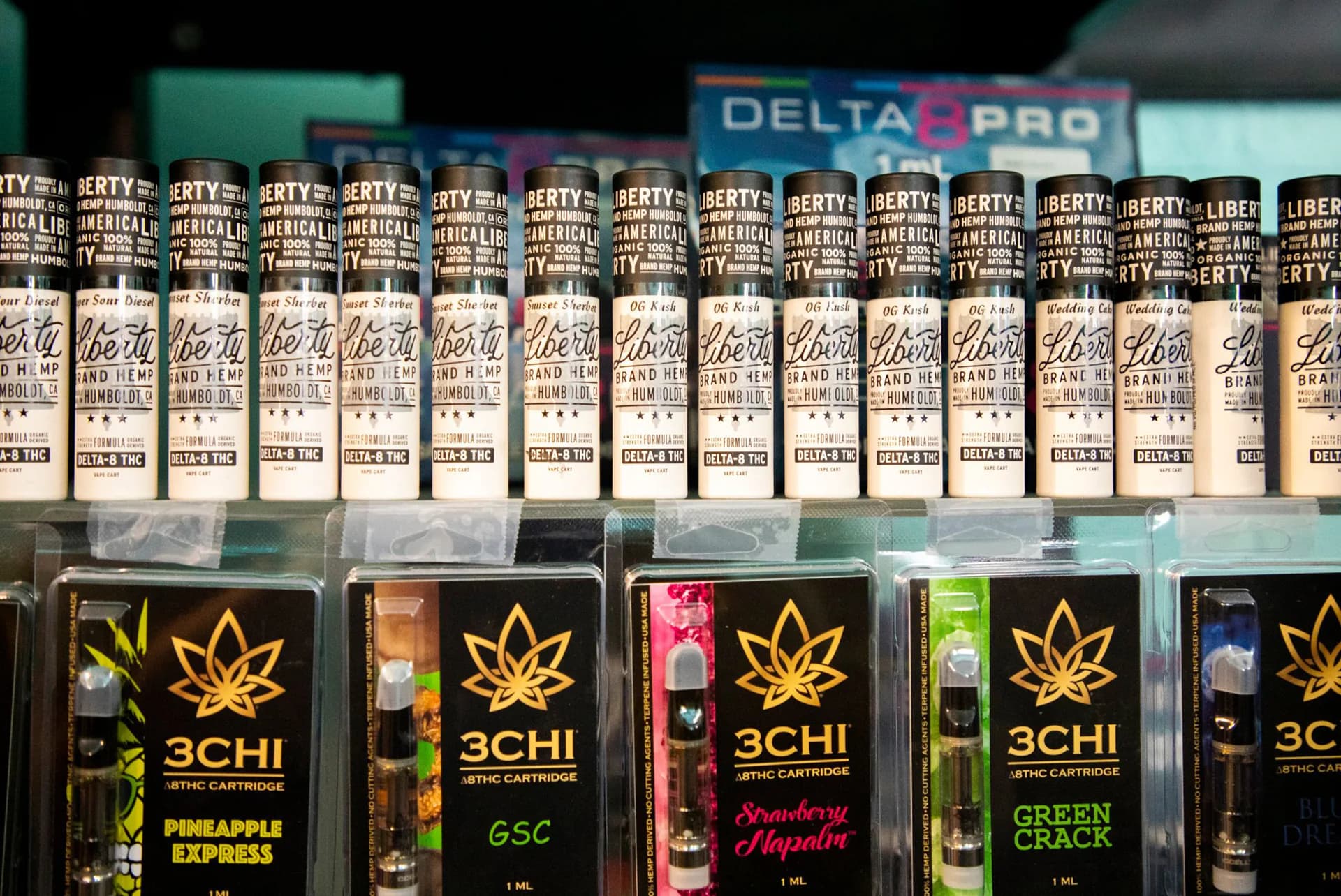 Vape cartridges of Delta 8 THC are displayed on shelves behind the counter in Cannabliss Dispensary on Wednesday, July 7, 2021, in Chapel Hill, North Carolina.