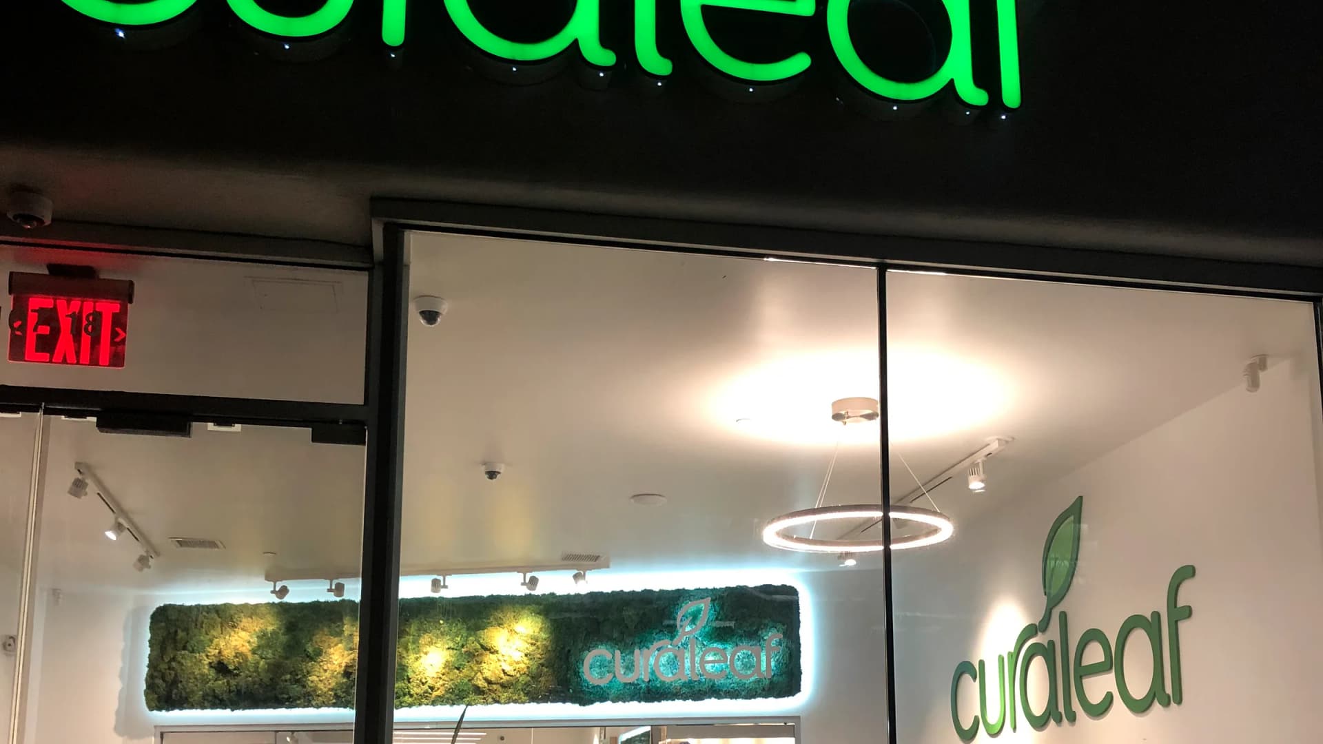 The illuminated sign of a Curaleaf medical marijuana dispensary is seen at its storefront entrance in Queens, New York. | Lindsey Nicholson/Education Images/Universal Images Group/Newscom