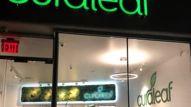 The illuminated sign of a Curaleaf medical marijuana dispensary is seen at its storefront entrance in Queens, New York. | Lindsey Nicholson/Education Images/Universal Images Group/Newscom