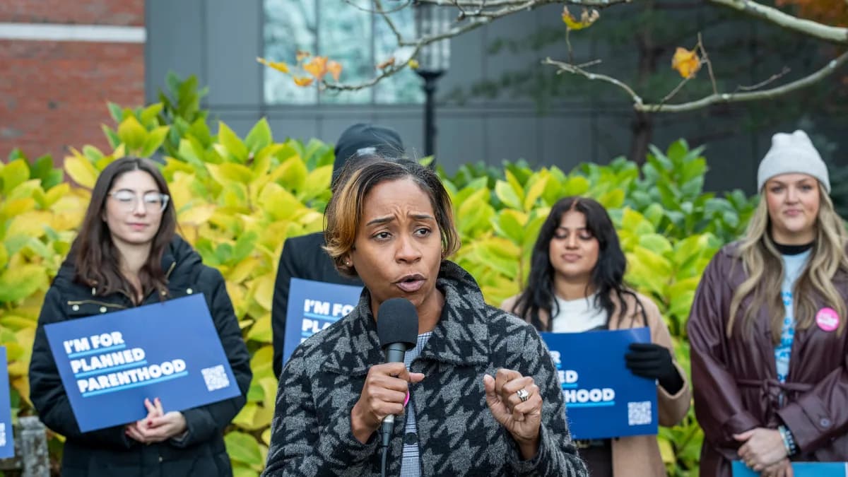 Massachusetts Attorney General Andrea Campbell speaks outside the John Joseph Moakley Courthouse in Boston in November 2025. | Marilyn Humphries/Newscom