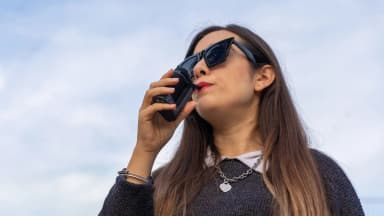 A woman inhales from a Storz & Bickel Crafty+ vaporizer outdoors. Devices like these are now permitted for Georgia medical cannabis patients under SB 220. (VapeExperts)