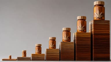A cut-paper diorama of amber medicine bottles stacked as a steep staircase rising left to right against a pale grey background. (VapeExperts/AI)