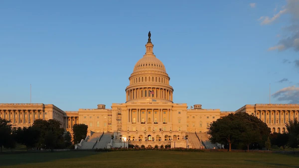 The US Capitol building with its dome and west facade lit by warm sunset light under a clear blue sky. | Martin Falbisoner/Wikimedia Commons (CC BY-SA 3.0)