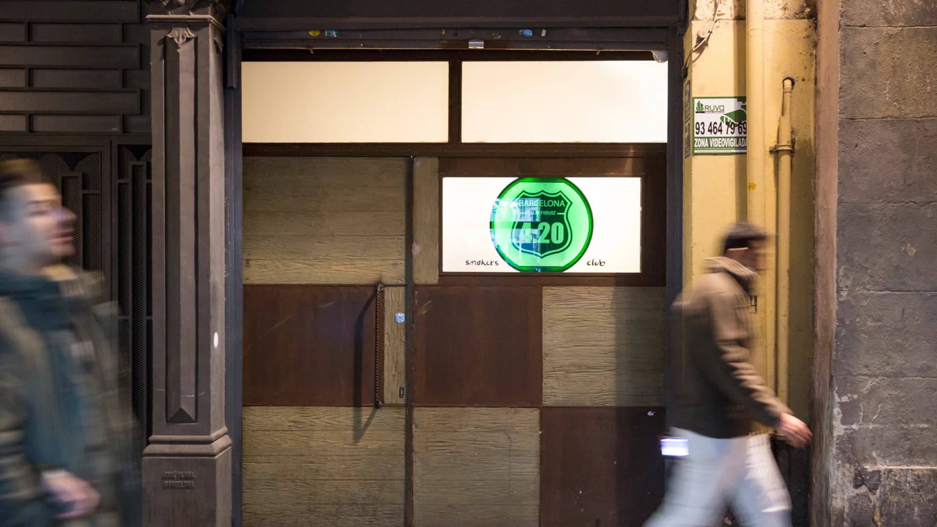 Pedestrians walk past the entrance to the 4:20 Smokers Club in Barcelona, Spain, on Dec. 27, 2015. Cannabis clubs like this one have thrived in Spain despite operating without a legal framework. (German Parga/dpa/picture-alliance/Newscom)