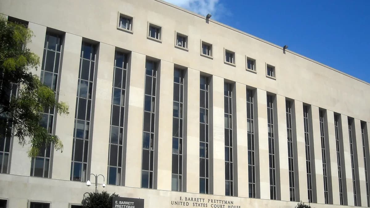 Exterior of the E. Barrett Prettyman United States Court House in Washington, D.C., a large stone building with tall narrow windows and a black sign... | AgnosticPreachersKid/Wikimedia Commons (Public domain)