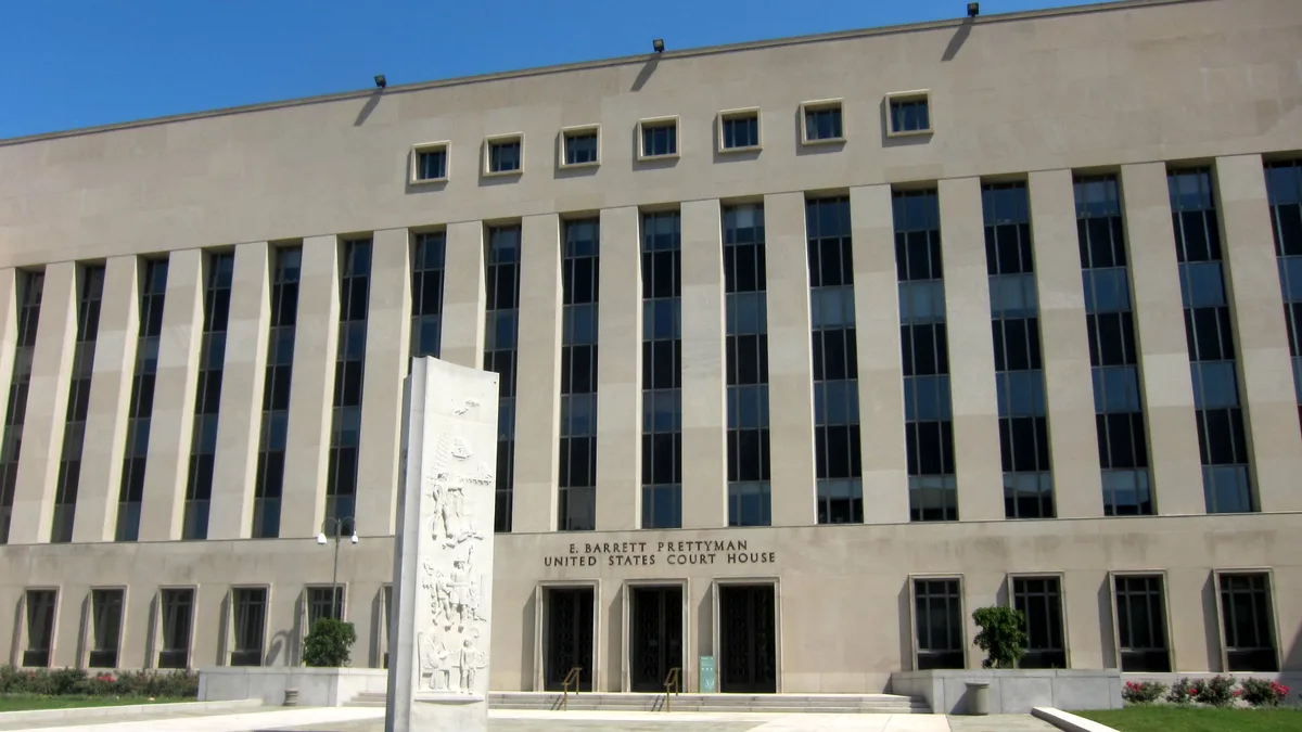 Limestone facade of the E. Barrett Prettyman United States Court House with tall narrow windows, three bronze entrance doors and a carved stone... | AgnosticPreachersKid/Wikimedia Commons (CC BY-SA 3.0)